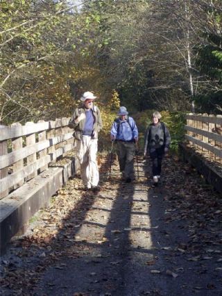 Kathy Biever leads a Mountaineer hike along the White Horse Trail last fall. The White Horse Trail follows the former railroad line from Arlington to Darrington