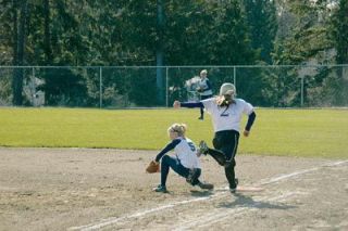 Abbie Milless stretches to snag a throw