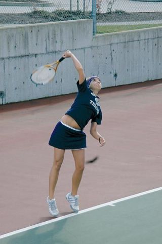 Megan Graham swings through a serve during her match with Alyssa Burrell of Cascade