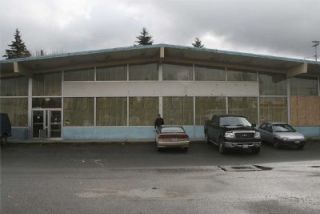 Arlington Cenex Co-Op Supply Branch Manager Zeek Maier stands outside the former Safeway building