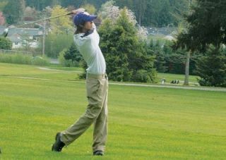 Arlington sophomore Tyler Kent keeps his eye on the ball. The shot was one of Kents 83 to complete the 18 holes at Cedarcrest Golf Course.