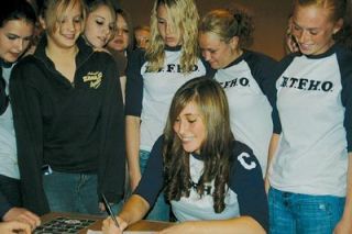 Surrounded by her teammates