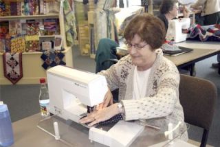 The binding for this quilt is finished by Ursula Hammer of Marysville.