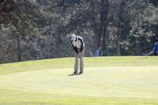 Arlington junior Tyler Kent putts in his team-high 82-stroke performance at Snohomish Golf Course.