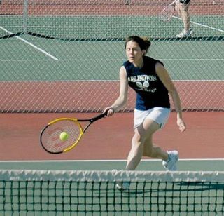 Colleen McElroy hits a return during her April 23 match with Mallory Good.