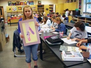 Haller Middle School seventh-grader Olga Katsyuba finishes a mosaic portrait of ballet shoes for the visual art exhibit Celebrating the Performing Arts which will be a part of the grand opening celebrating of the Arlington Performing Arts Center this weekend.