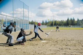 Ally Milless hit this pitch long but foul.  The Arlington bats could not straighten much out against Monroe.