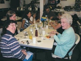 Members of the Arlington Kids Kloset enjoy a volunteer appreciation luncheon in the Local Scoop