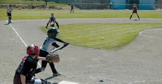 Arianna Barrio gets aboard with a single for the Stilly Elite girls fastpitch team.