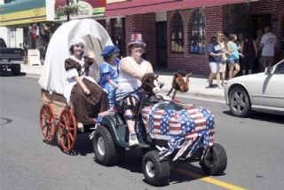 Vicki Mulvany steers the covered wagon of daughters Becca and Jenny