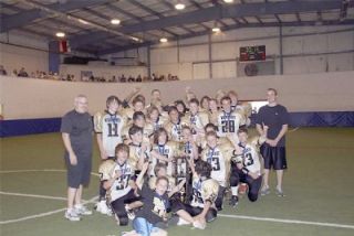 The victorious Marysville Wolverines pose with the championship trophy