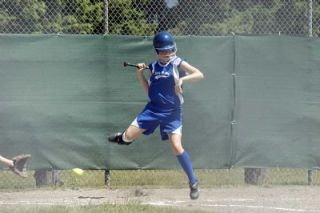 Outfielder Marisa Rathert sidesteps a low pitch. Stilly Valley took advantage of their walks to build a 9-0 lead in the bottom of the first inning.