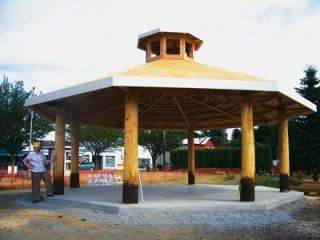Susan Bonasera of The Arlington Times examines progress on the gazebo Monday
