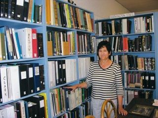 Michelle Heiderer looks over the hundreds of old