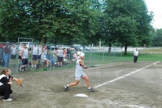 Angel Tilton belts out one of her three hits on the night.  Her production at the plate helped lead Menzel Lake to a convincing victory.
