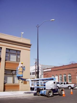 A tall light post is installed on the corner of Third Street and Olympic Avenue Monday