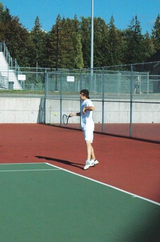 Garrett Meyer rips into a forehand during the Eagles match against Snohomish.