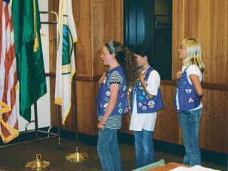Camp Fire girls lead flag salute