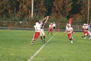 Jerad Barber extends his arms to make a tough catch over the middle during Arlingtons game with Snohomish.