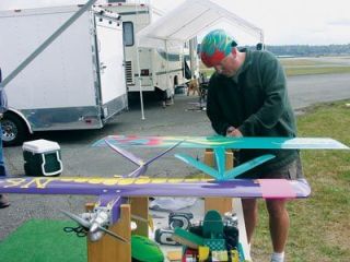 Eric Ide adjusts the props on his expert-quickie radio-controlled planes