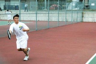 Arlingtons No. 4 singles player Zach Tankersley chases down a return along the baseline during his Sept. 21 match with Cascades Jonathan Phan.
