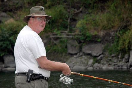 Arlington resident Jim Caldwell stands at the banks of the Stillaguamish River as he fishes for pink salmon Sept. 1.