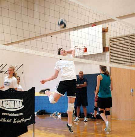 Freshman Amy Zimmerman works on her form as she practices spiking the ball.