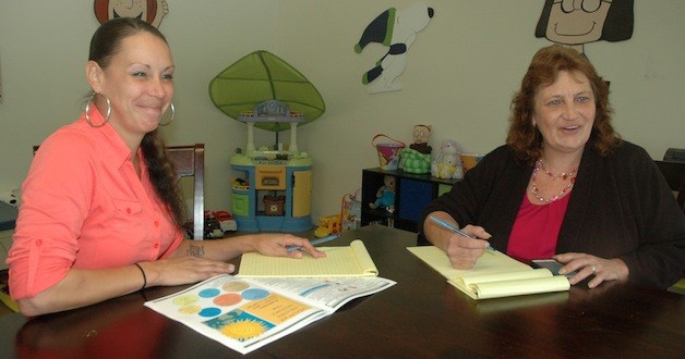 Amber Arnold and Lori Morgan serve as family support specialists at the Arlington Community Resource Center.