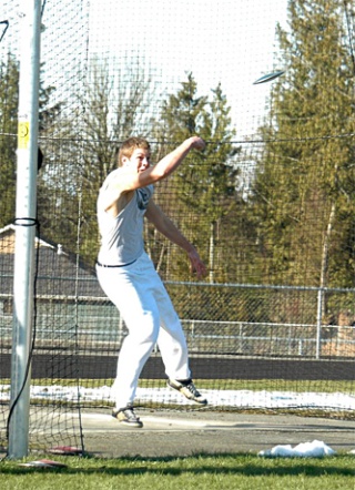 Arlington senior Andrew Languille takes his turn at the discus.