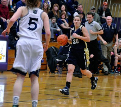 Arlington’s Krista Showalter dribbles down the court during the Friday