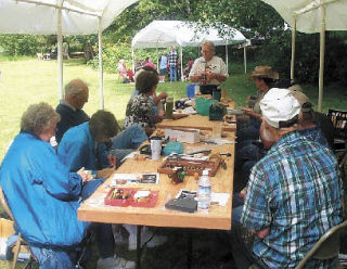 Laura Fraser demonstrates wood carving at a Spit-n-Whittle event of the Quil Ceda Carvers. She is the featured carver at this years Artistry in Wood show at the Evergreen State Fairgrounds in Monroe April 19 and 20.