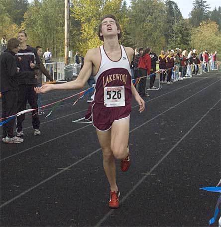 Taylor Guske crosses the finish line at 16:26 to tie the meet record and earn his second individual conference title.