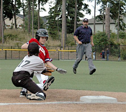 Third baseman Brandon Tucker applies the tag