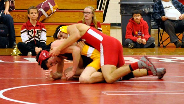 Lakewood senior George Treml sets up bridge beneath M-P’s Jose Villagomez.