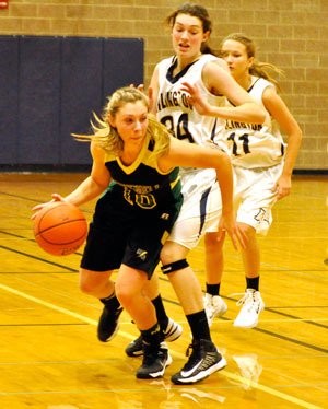 Arlington junior Brittany DeNike guards M-G freshman Gabby Grandbois.