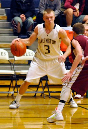 Senior point guard Kaleb Bryson looks for a way past a Cascade defender. Bryson totaled four three-point shots against Cascade.