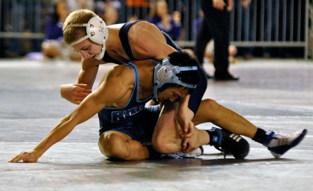 Arlington sophomore Jeremy Nygard dominates his opponent in the second match at the State Tournament on Feb. 22.
