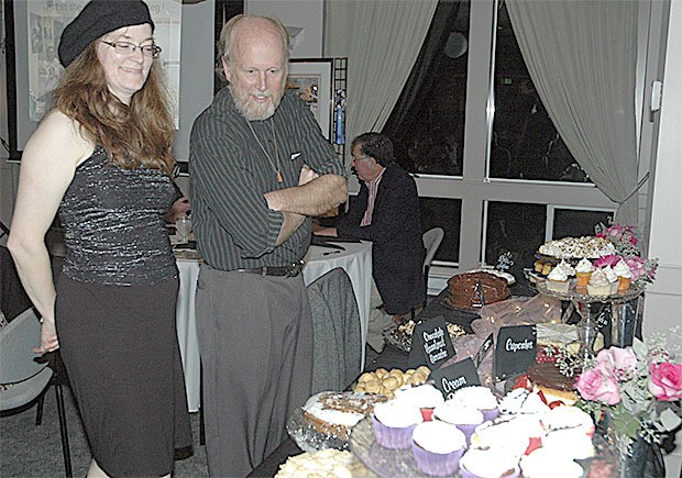 Sarah and Bill Blake check out the dessert selection at the Arlington Arts Council's 'Fall Into Art' auction Oct. 18.