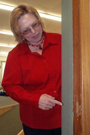 Stillaguamish Senior Center Program Administrator D.J. Winebrinner shows where the lock on the door to the senior center's offices was broken.