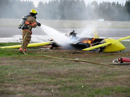 Arlington firefighters put out a fire after a small aircraft crashed Sept. 30 at Arlington Municipal Airport. The pilot was not injured.