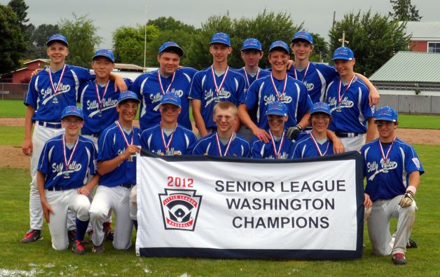 The Stilly Valley Little League Seniors hold up their State Tournament Championship sign following their victory over Richmond in the final championship game on June 22. Front row from left