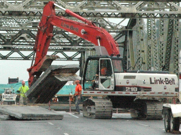 Mowat Construction crews remove slabs of the concrete deck of the I-5 southbound Stillaguamish Bridge Aug. 15.