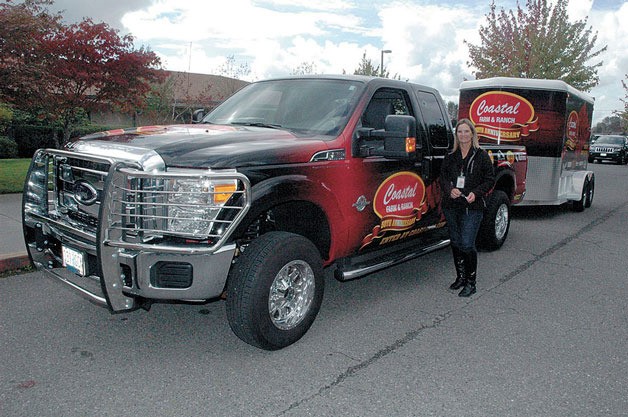 Coming in at No. 5 of the Arlington Times' Top 10 web stories for 2013: Kent Prairie Elementary fourth-grade teacher Leah Robinson is all smiles as she stands next to the 2013 diesel-fueled Ford F-250 Super Duty pickup truck and two-horse steel trailer that the Oregon-based Coastal Farm & Ranch chain presented to her at her school on Sept. 24