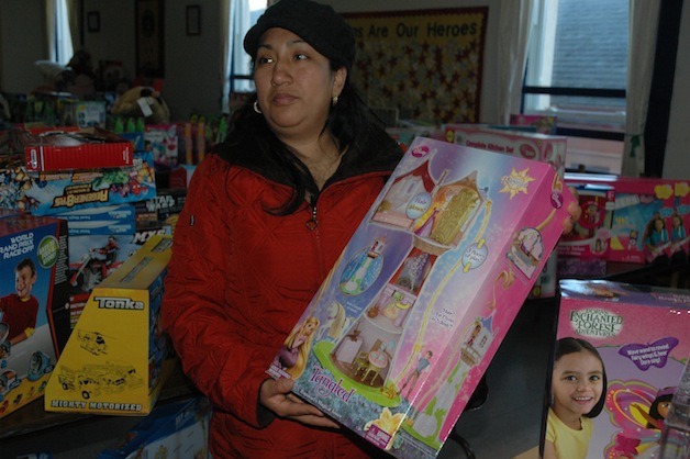 Miriam Villalba picked out a gift for her 3-year-old girl at one of Arlington American Legion Post 76’s previous ‘Toys for Kids’ holiday toy distributions.
