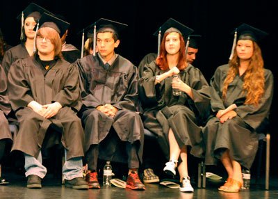 Weston High School Class of 2012 graduates wait on stage to receive their diplomas during the June 13 commencement ceremony at the Byrnes Performing Arts Center.