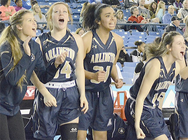 Arlington girls celebrate as they open up a big lead in the second half against Lincoln in their first-round game at state March 3.