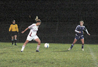 Senior forward Laina Weber plants herself for a kick.