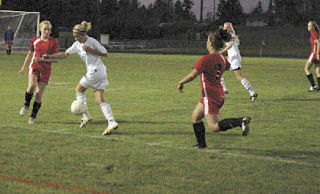 Lakewood midfielder Maddie Chamberlin looks back for the pass as she drives against the Coupeville defense. The sophomore had two goals in the team’s 6-0 win.