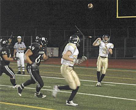 Arlington quarterback Andy Smith looks for running back Riley Cobb on a screen pass.