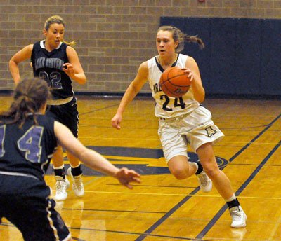Arlington junior guard Jessica Ludwig looks for a way through Lake Steven's defense.